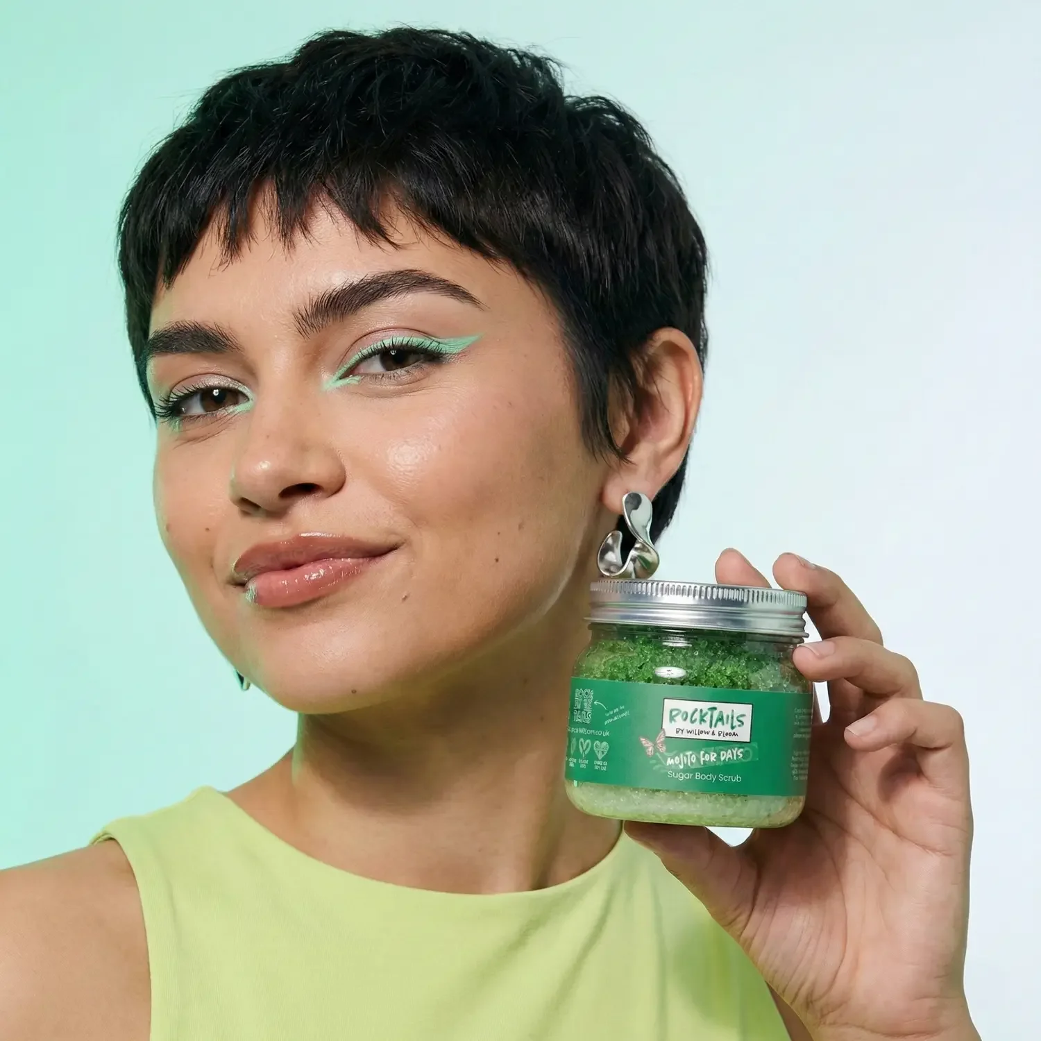 short-haired-model-holding-a-mojito-sugar-body-scrub.webp