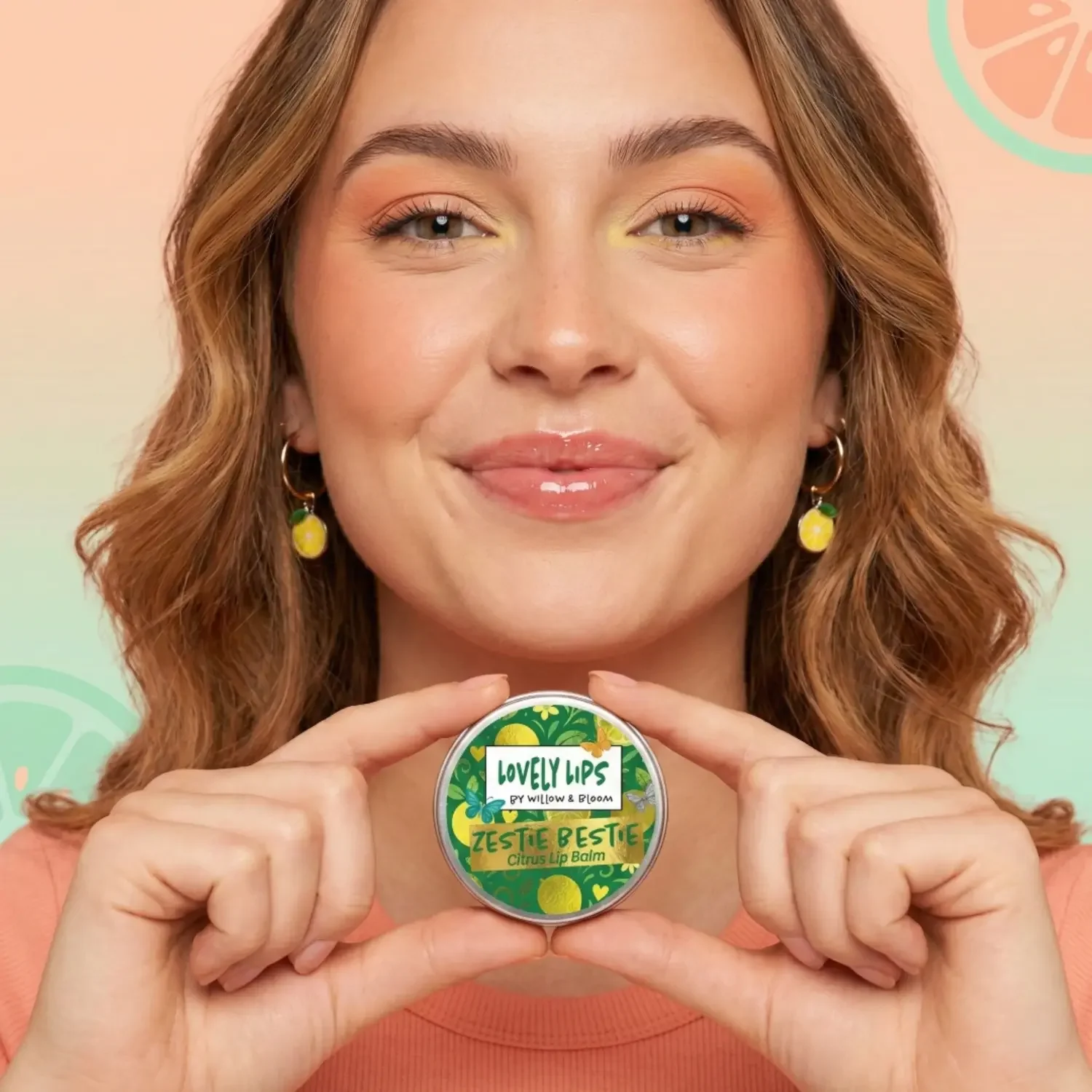 pretty-model-holding-citrus-lip-balm.webp