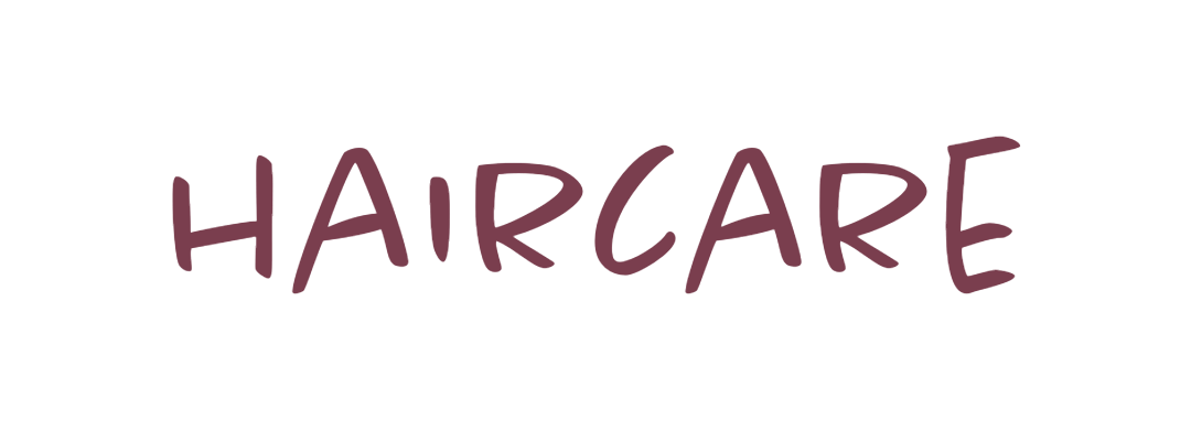 Text graphic with 'HAIRCARE' written in purple, casual handwritten font on a white background.
