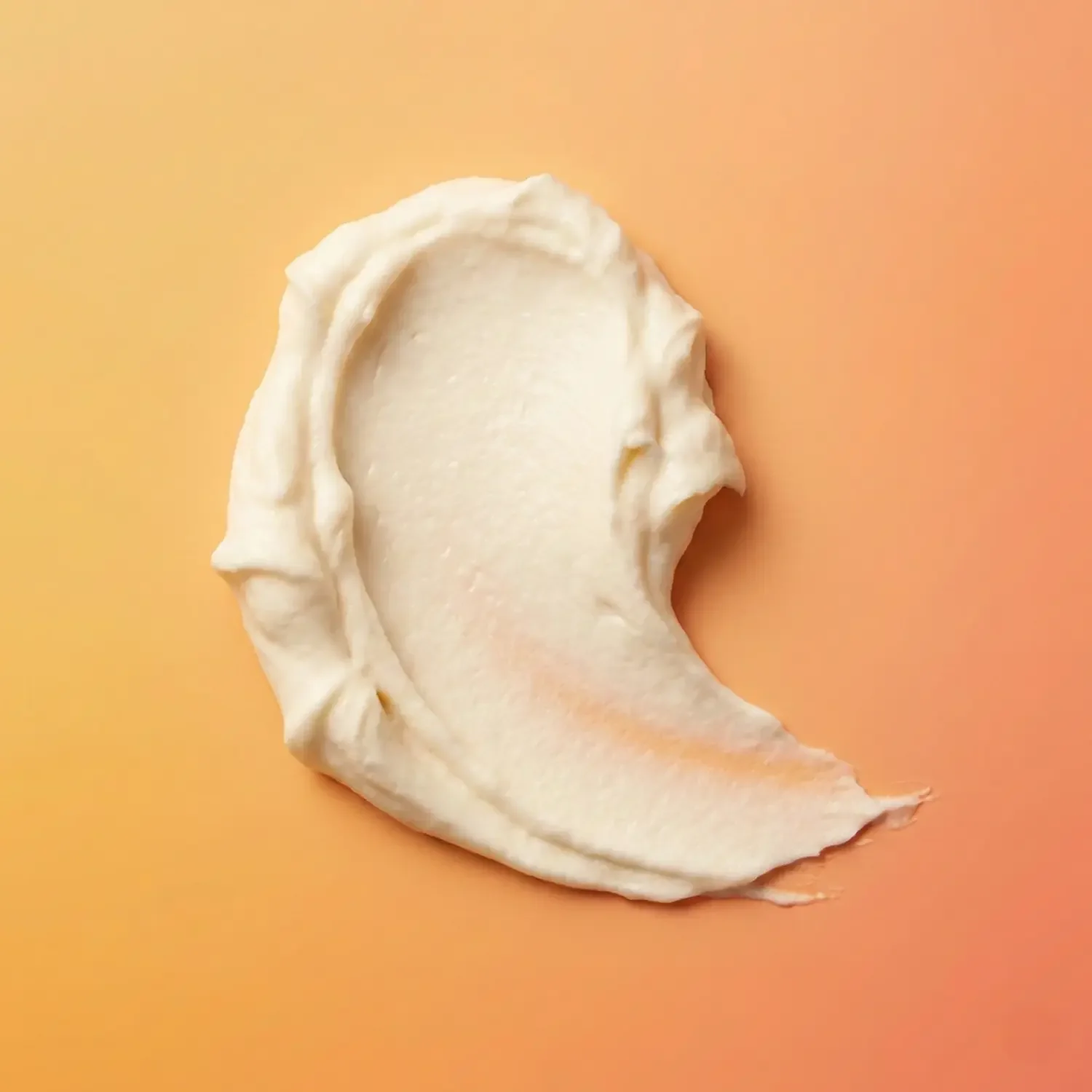 smudge-of-shea-body-butter-on-a-mango-gradient-background.webp