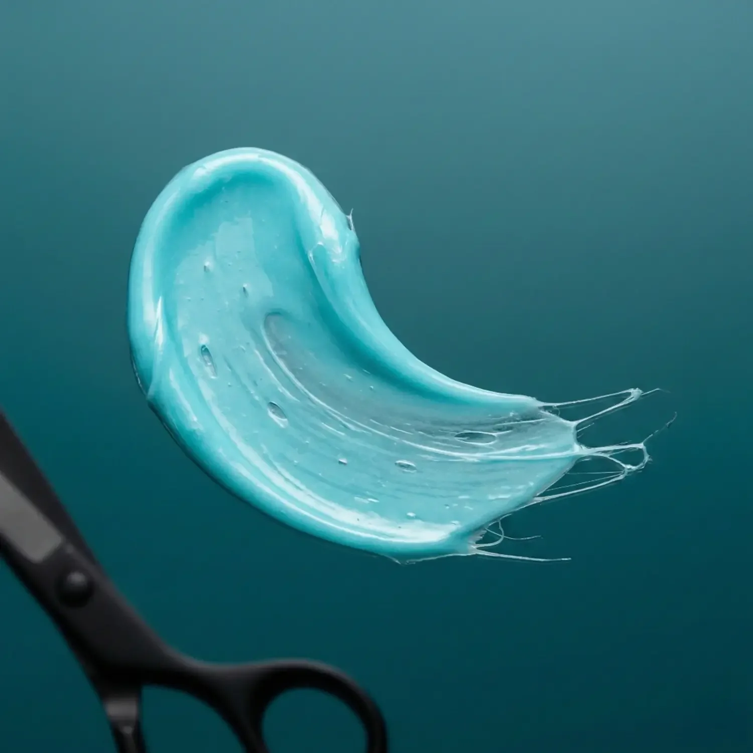 smudge-of-hair-fibre-gum-on-blue-background.webp