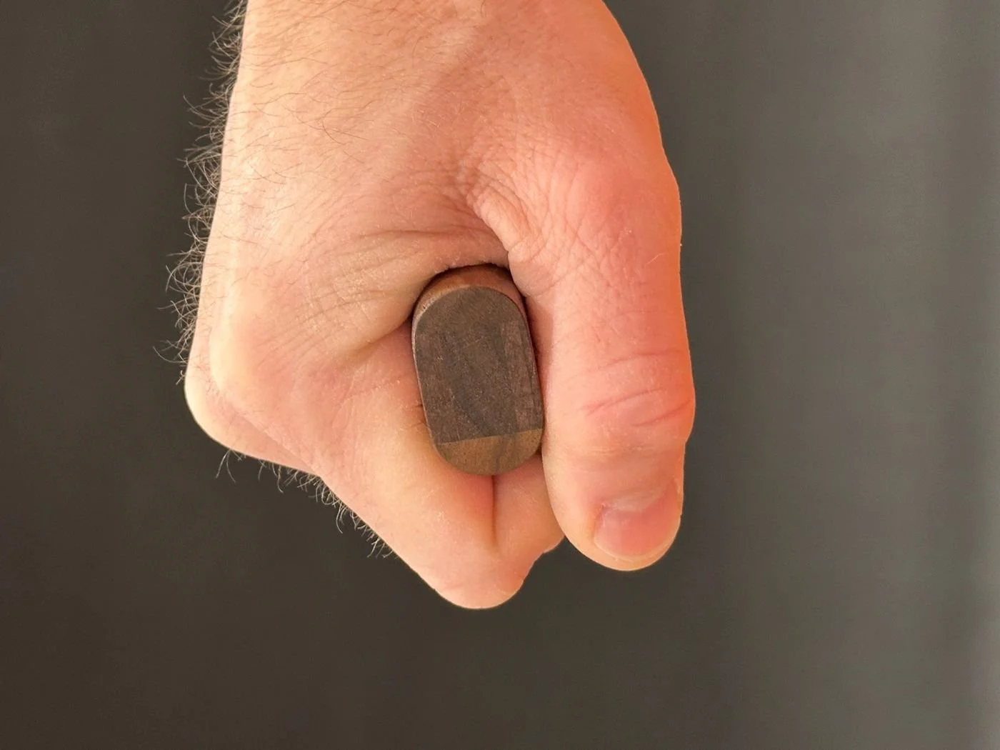 Cross-section of a RockSpring Net handle made from premium North American hardwood, showing the patented 360-degree ergonomic full-contact gripe design.