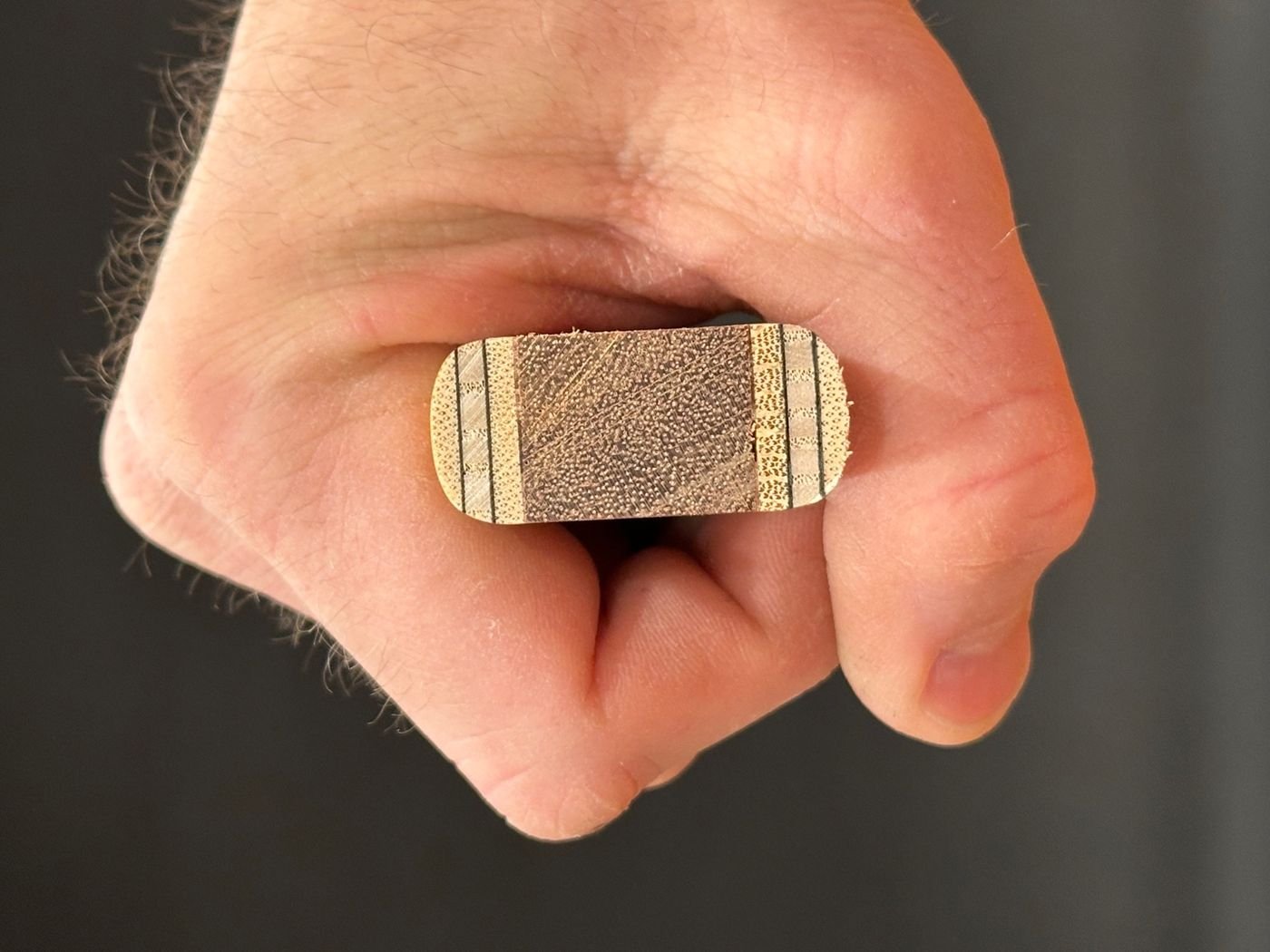 Cross-section of a competitor's net handle showing visible gaps between the handle and an angler's hand grip, highlighting poor ergonomics and reduced control compared to RockSpring Nets.