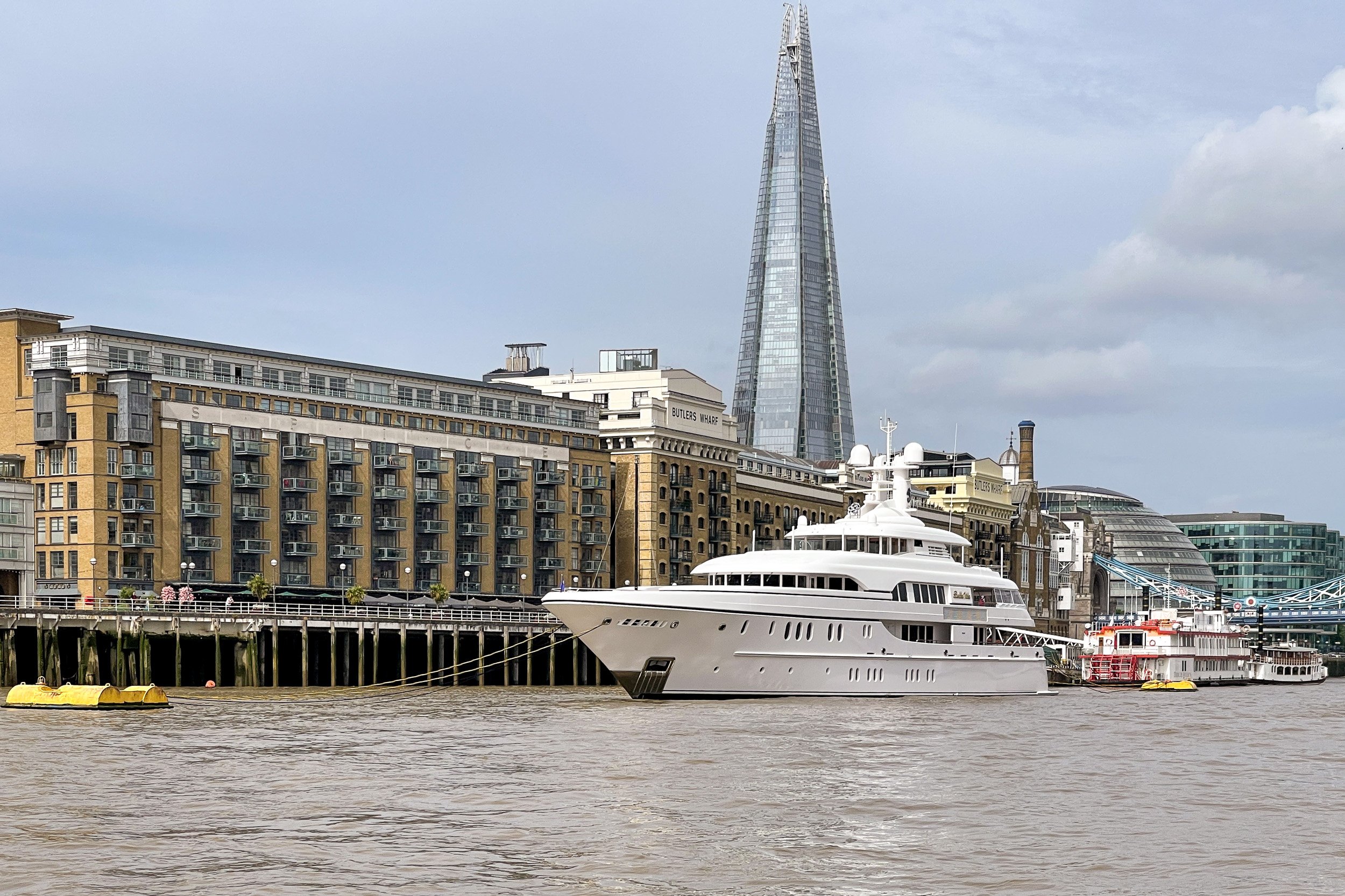 Superyacht Bella Vita moored on the Thames with the Shard in the background