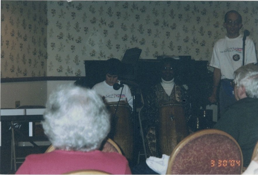 Jeanine Mooers playing the conga with The Note-Ables.
