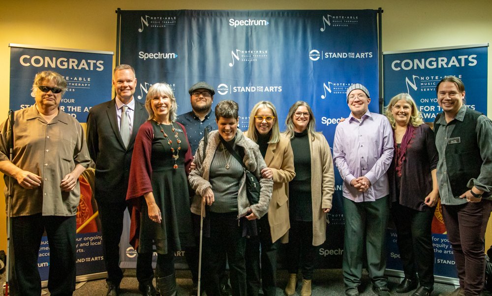 Photo of Jeanine Mooers and others posing with Mayor Schieve after receiving Ovations Stand for the Arts award.