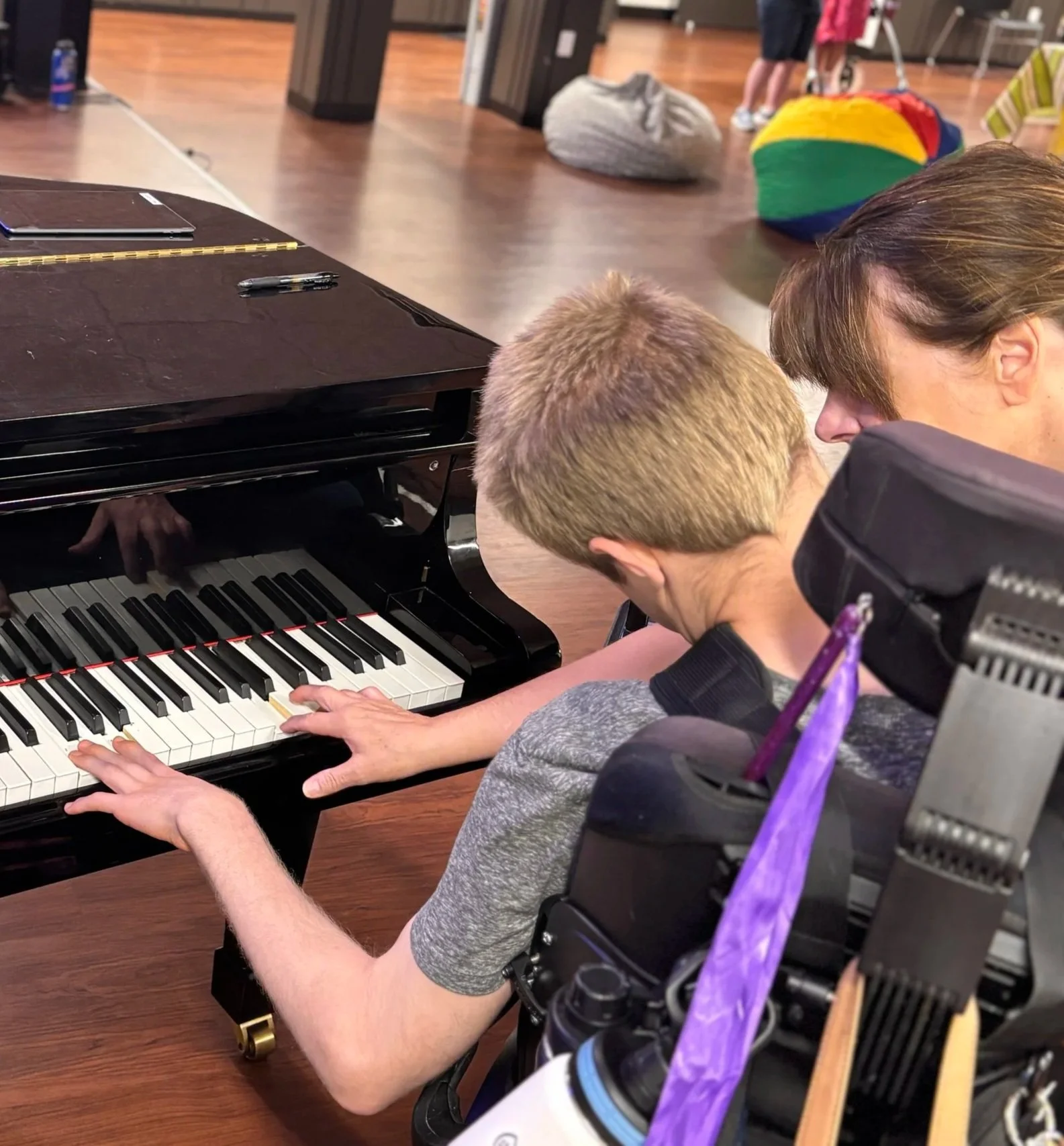 Individual at the 2025 NMTS teen and adult summer music camp playing piano
