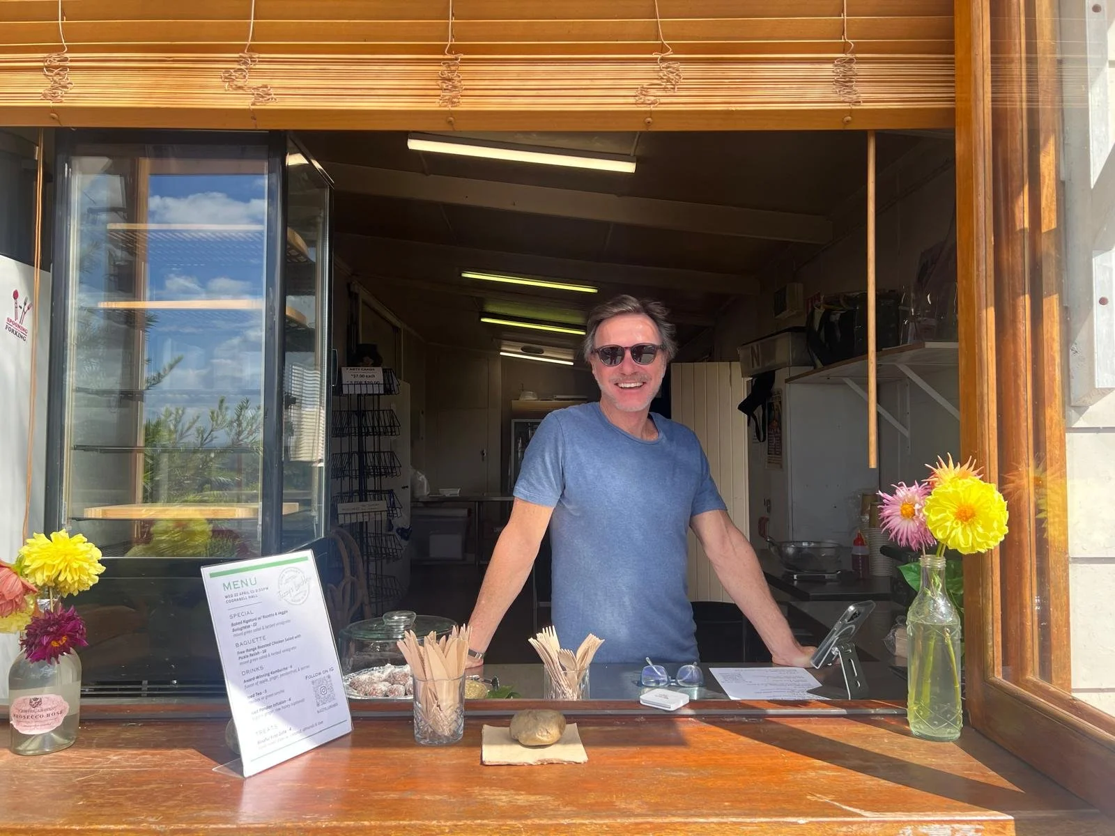 Richard serving with a smile at Juzzy's Lunchbox