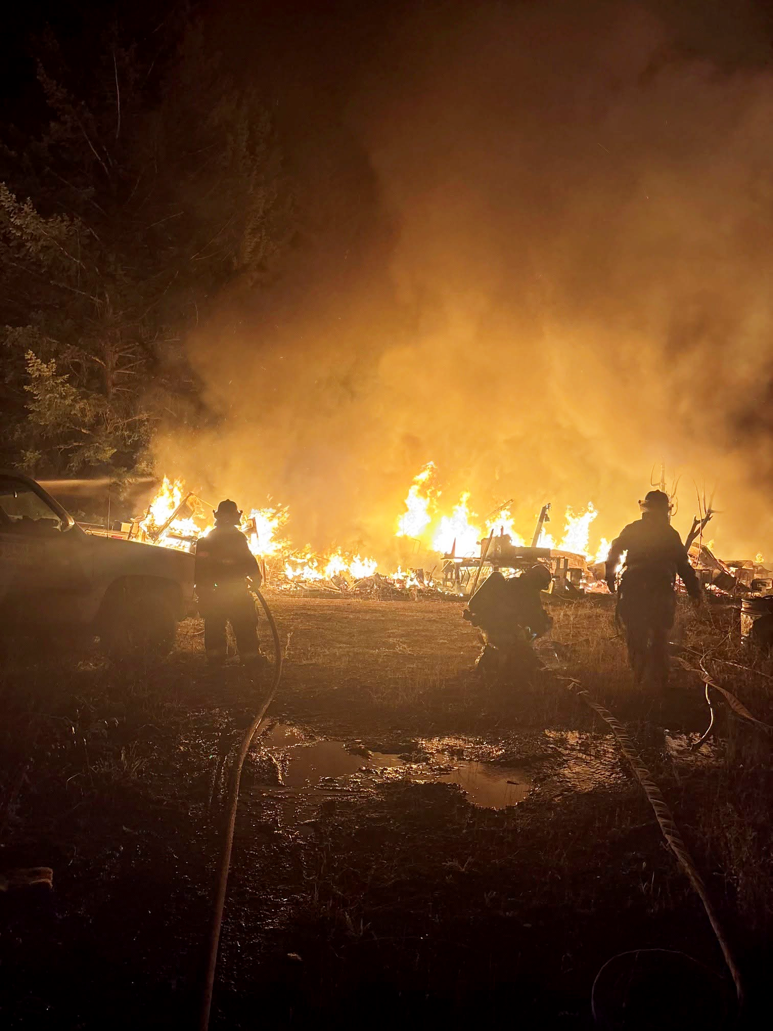 Firefighters fighting fire in Tappen - Shuswap