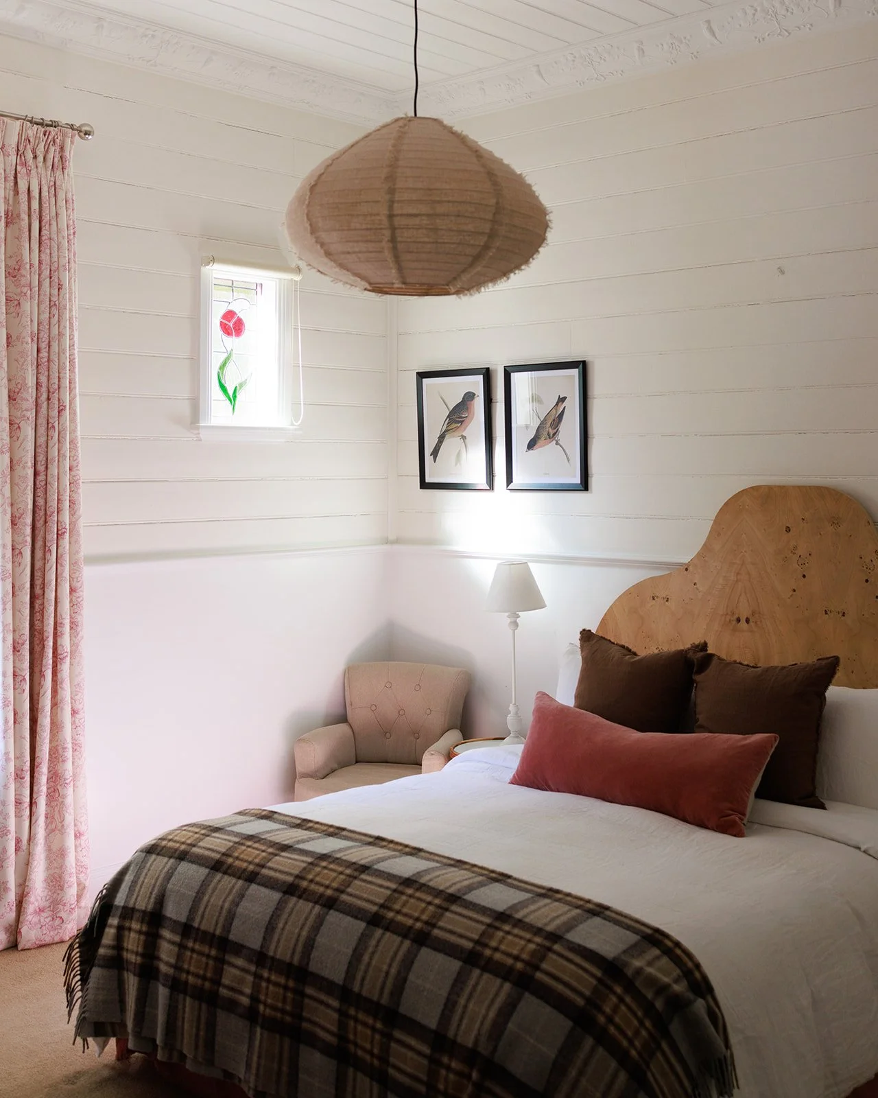 Lovely warm touches of raspberry and chocolate colours make Bedroom Three of Kelly House charming.  