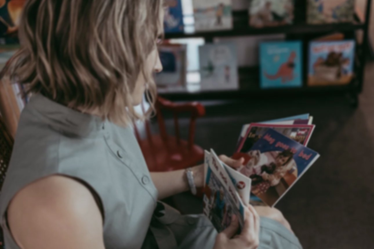 Adult looking at reading resources