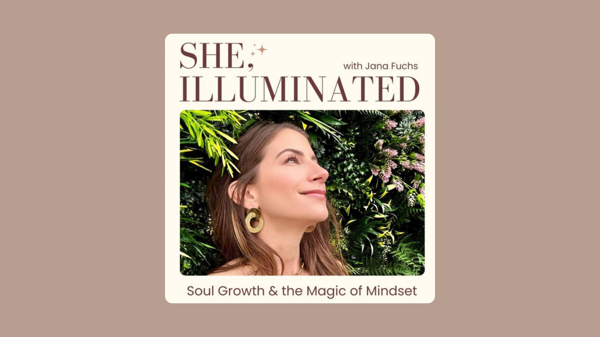 Book cover titled 'She, Illuminated: Soul Growth & the Magic of Mindset' with a woman smiling, surrounded by green and pink foliage.
