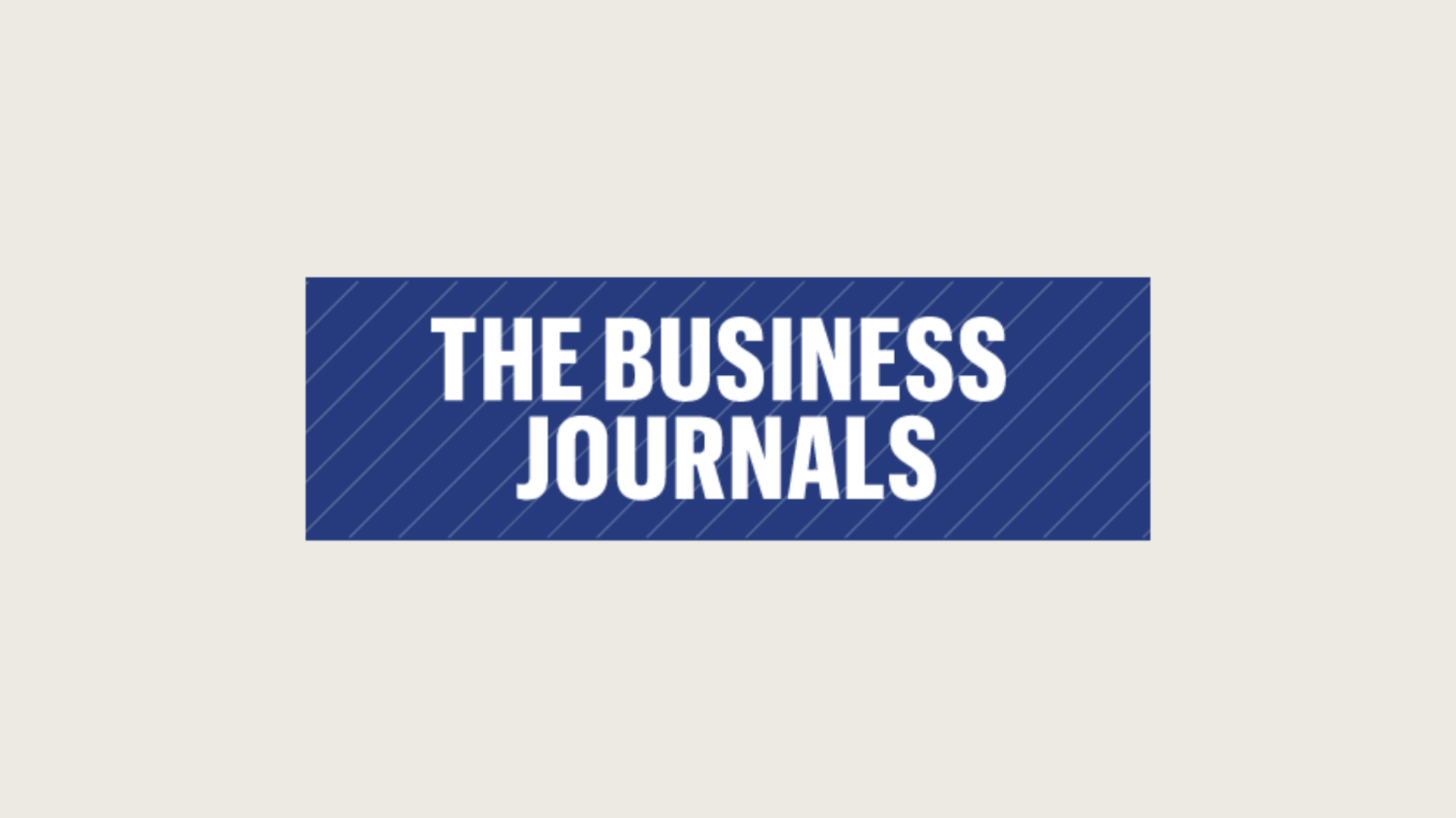 Logo of The Business Journals with blue background and white text.