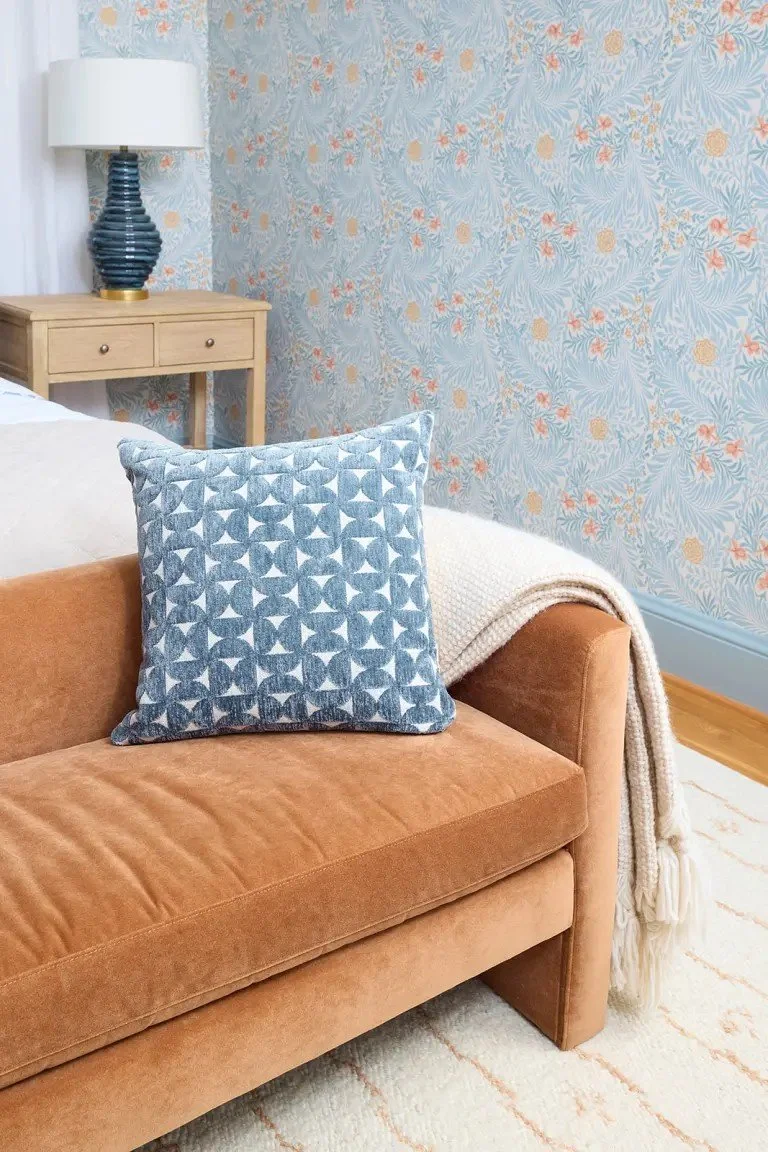 A modern-traditional primary suite renovation in Buffalo’s Allentown neighborhood, blending soft floral pattern, custom built-ins, refreshed cabinetry, classic tile, and contemporary furnishings for a young family.
