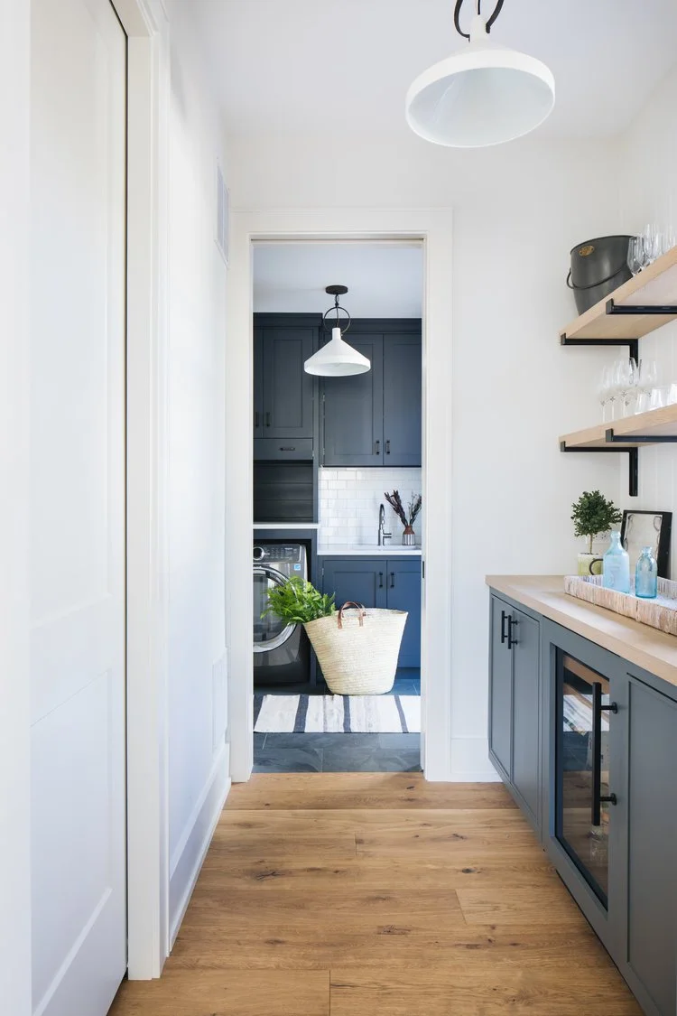 The result is a kitchen that perfectly balances simple, modern lines with classic Craftsman charm. Warm wood tones and deep green accents bring richness and character, creating a space that feels both grounded and inviting.