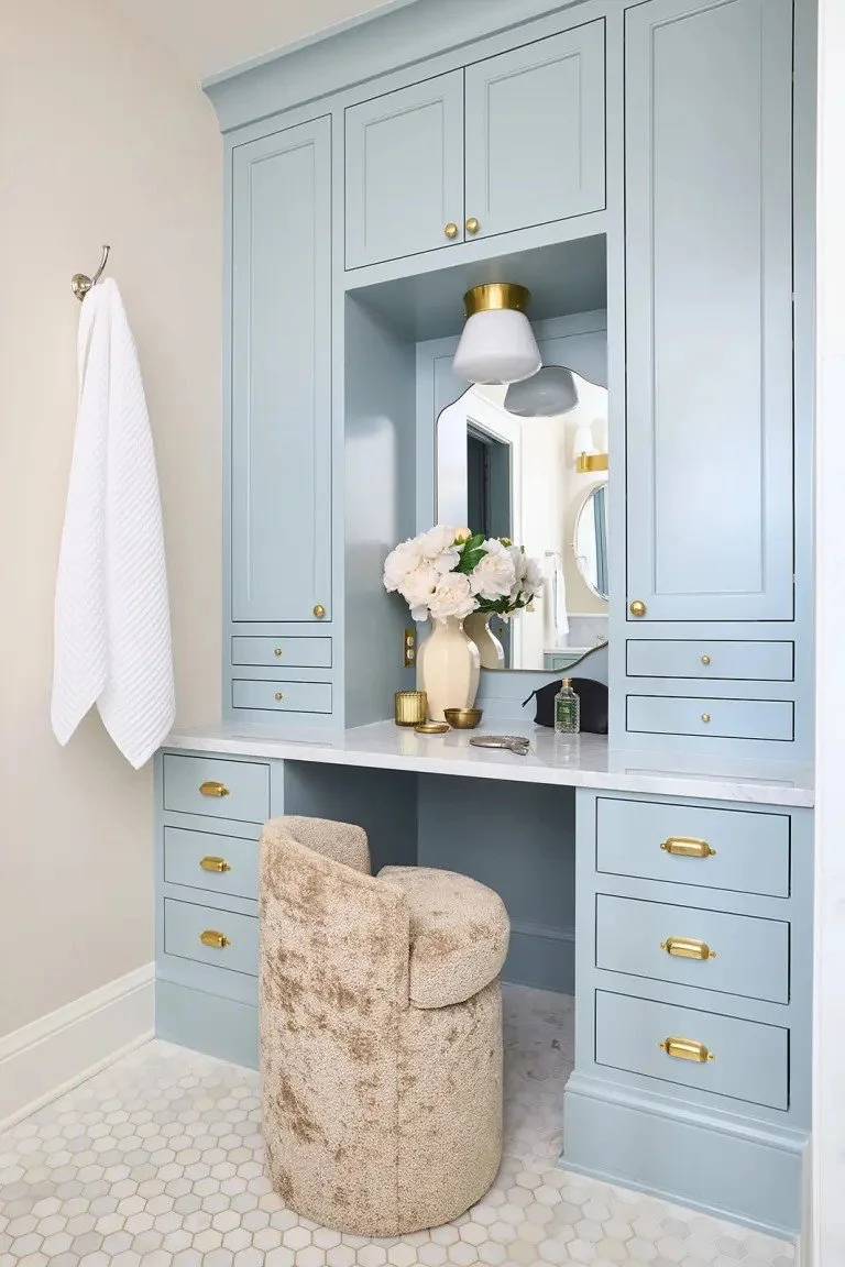 A modern-traditional primary suite renovation in Buffalo’s Allentown neighborhood, blending soft floral pattern, custom built-ins, refreshed cabinetry, classic tile, and contemporary furnishings for a young family.