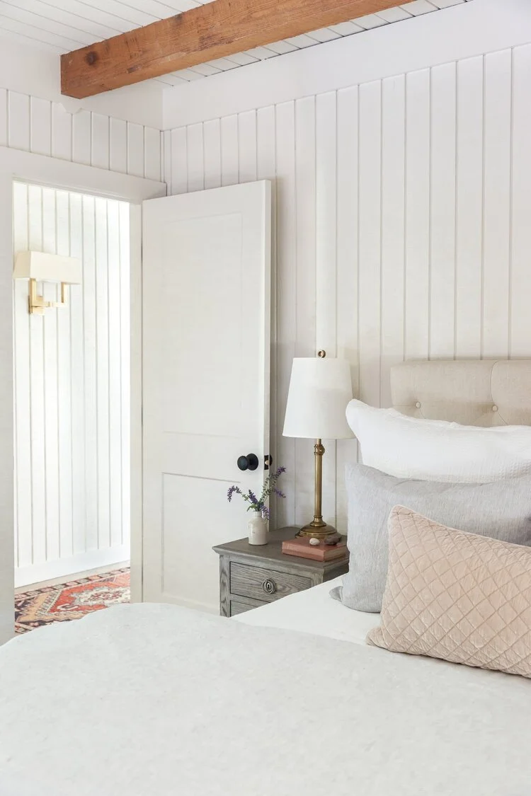 This custom attic renovation in East Aurora, NY transformed an underutilized upper level into a warm, functional, and thoughtfully designed bedroom retreat complete with a private en suite bathroom.