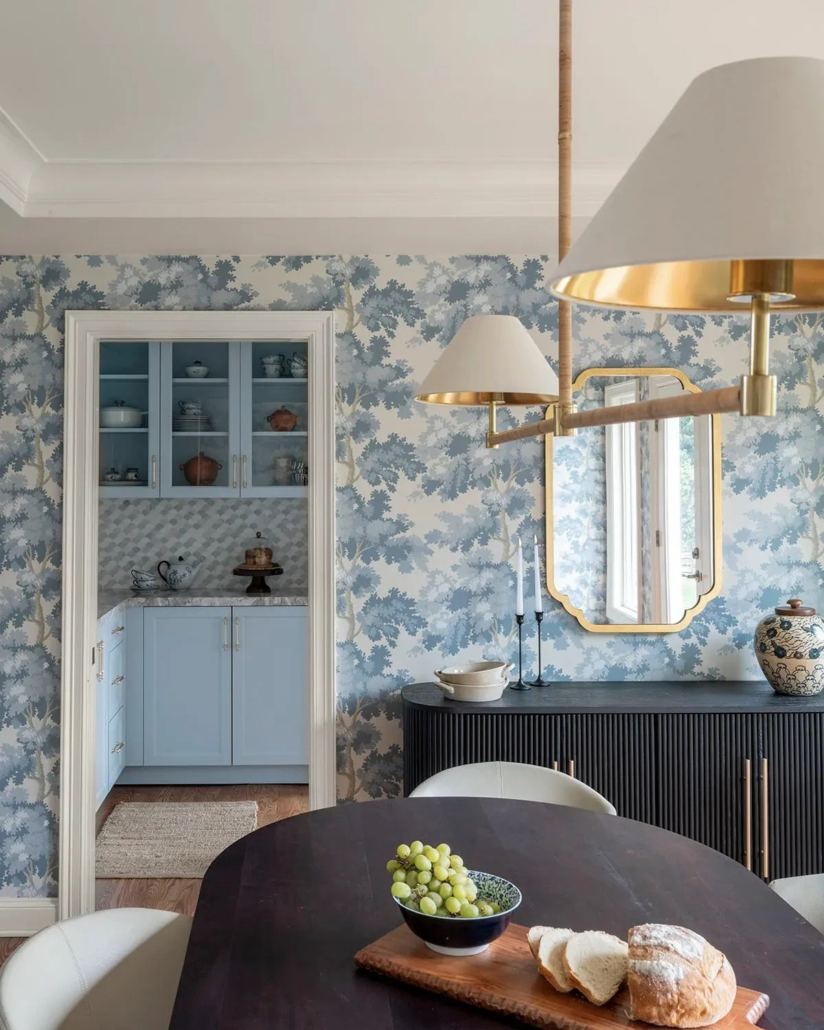 The design needed to feel light and functional in the kitchen, more intimate and layered in the dining room, and hardworking in the butler’s pantry. 