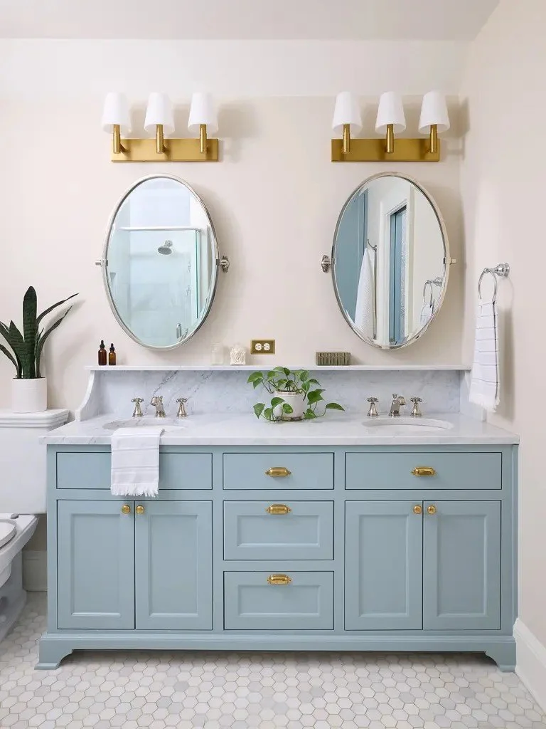 A modern-traditional primary suite renovation in Buffalo’s Allentown neighborhood, blending soft floral pattern, custom built-ins, refreshed cabinetry, classic tile, and contemporary furnishings for a young family.