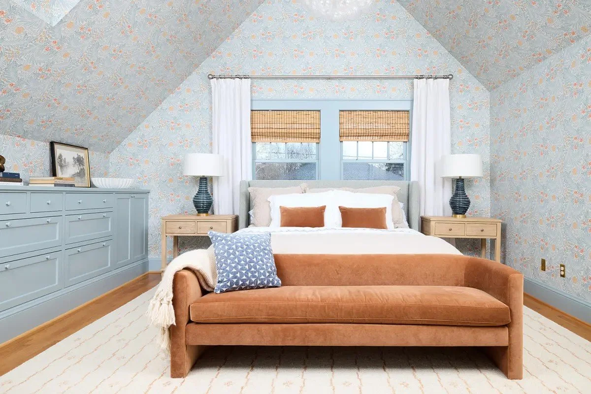 A modern-traditional primary suite renovation in Buffalo’s Allentown neighborhood, blending soft floral pattern, custom built-ins, refreshed cabinetry, classic tile, and contemporary furnishings for a young family.