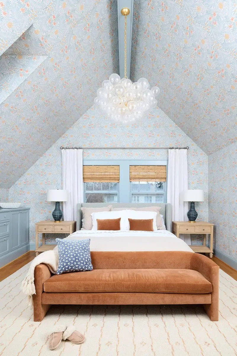 A modern-traditional primary suite renovation in Buffalo’s Allentown neighborhood, blending soft floral pattern, custom built-ins, refreshed cabinetry, classic tile, and contemporary furnishings for a young family.