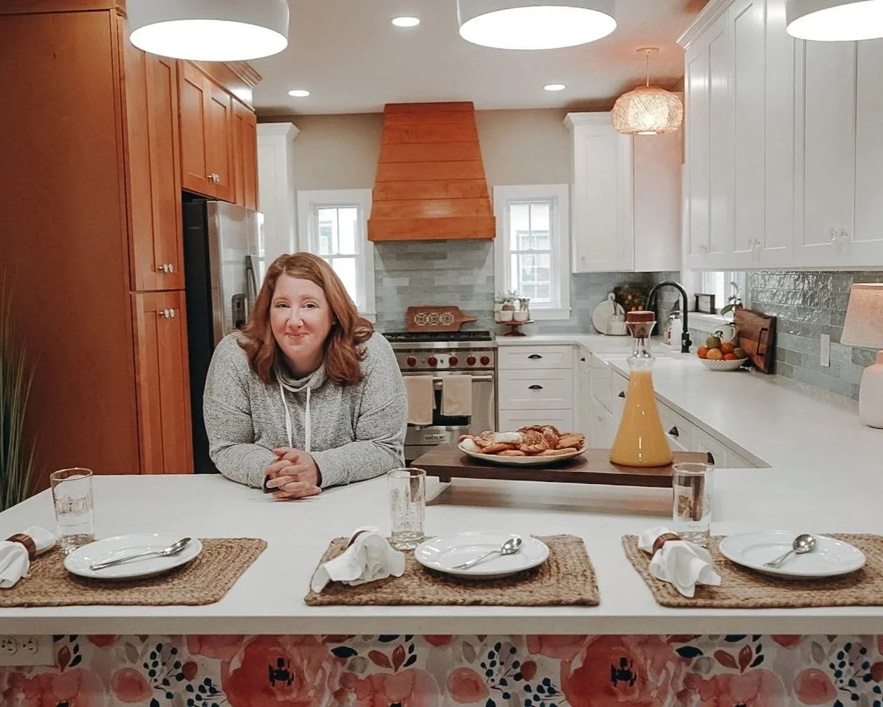 A tailored kitchen renovation featuring handcrafted custom cabinetry, improved storage, layered finishes, and a timeless design approach created for everyday family living and entertaining.