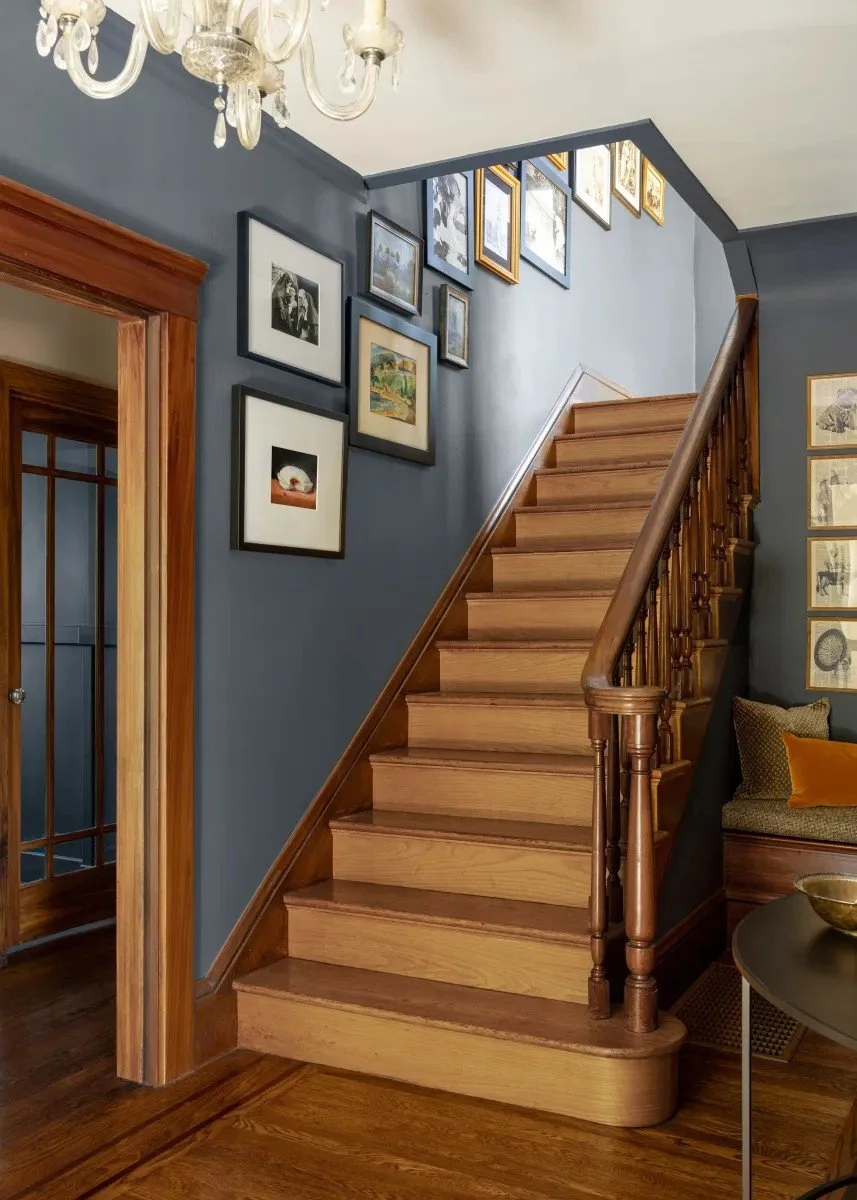 A classic Tudor Revival home in Tonawanda thoughtfully updated for a growing family through layered artwork, custom built-ins, rich color, family-friendly furniture, and a considered mix of traditional and modern design.