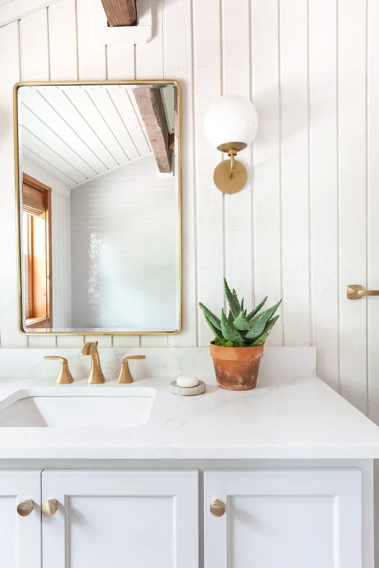 This custom attic renovation in East Aurora, NY transformed an underutilized upper level into a warm, functional, and thoughtfully designed bedroom retreat complete with a private en suite bathroom.
