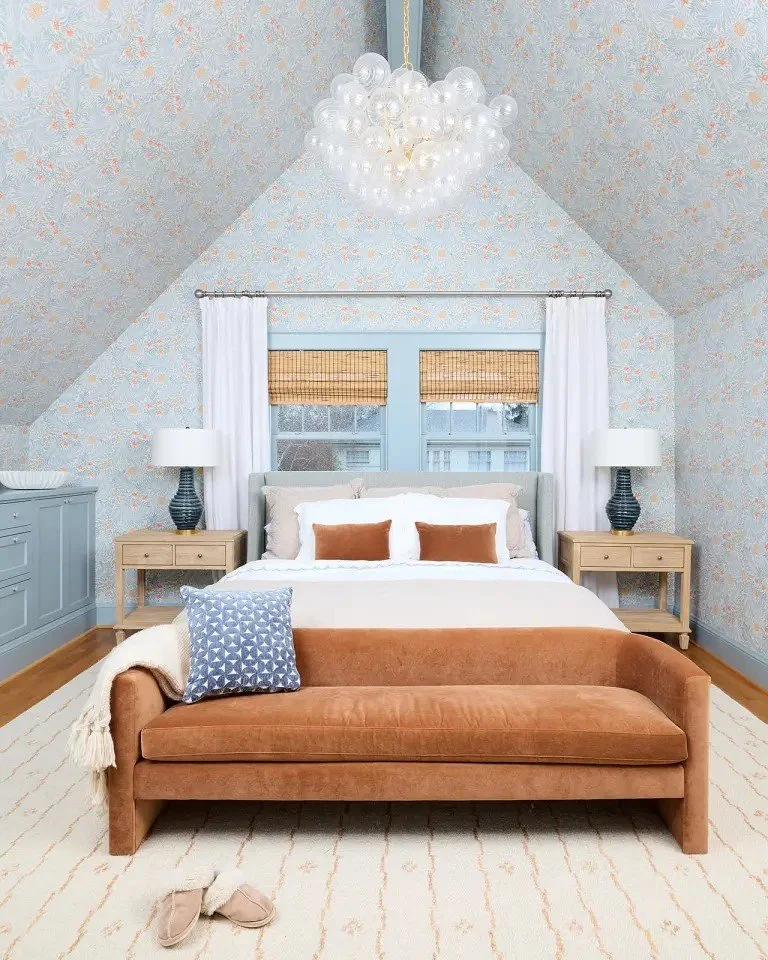 A modern-traditional primary suite renovation in Buffalo’s Allentown neighborhood, blending soft floral pattern, custom built-ins, refreshed cabinetry, classic tile, and contemporary furnishings for a young family.