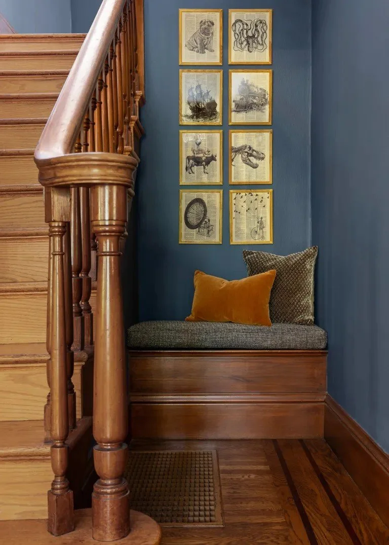 A classic Tudor Revival home in Tonawanda thoughtfully updated for a growing family through layered artwork, custom built-ins, rich color, family-friendly furniture, and a considered mix of traditional and modern design.