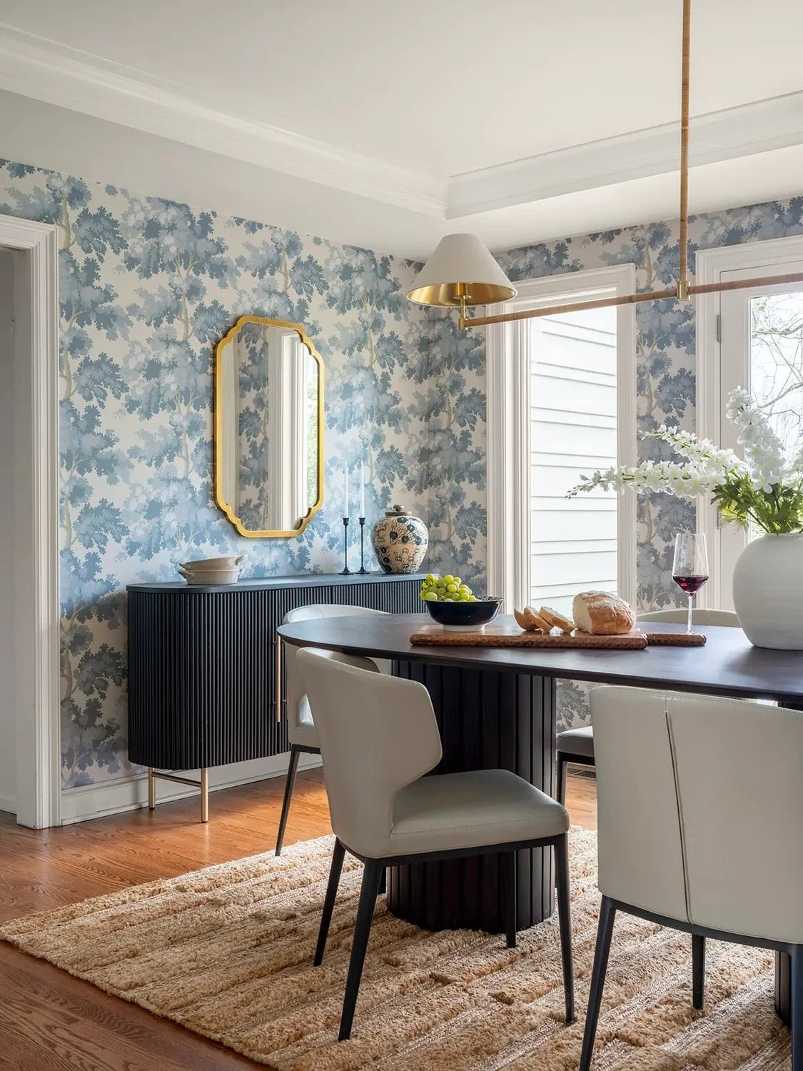 The design needed to feel light and functional in the kitchen, more intimate and layered in the dining room, and hardworking in the butler’s pantry. 