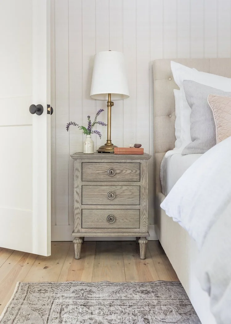 This custom attic renovation in East Aurora, NY transformed an underutilized upper level into a warm, functional, and thoughtfully designed bedroom retreat complete with a private en suite bathroom.