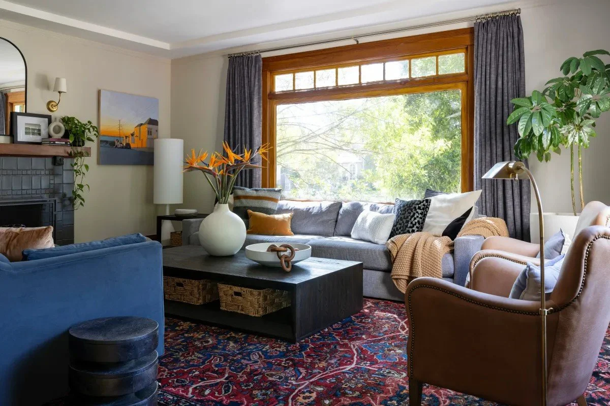 A classic Tudor Revival home in Tonawanda thoughtfully updated for a growing family through layered artwork, custom built-ins, rich color, family-friendly furniture, and a considered mix of traditional and modern design.