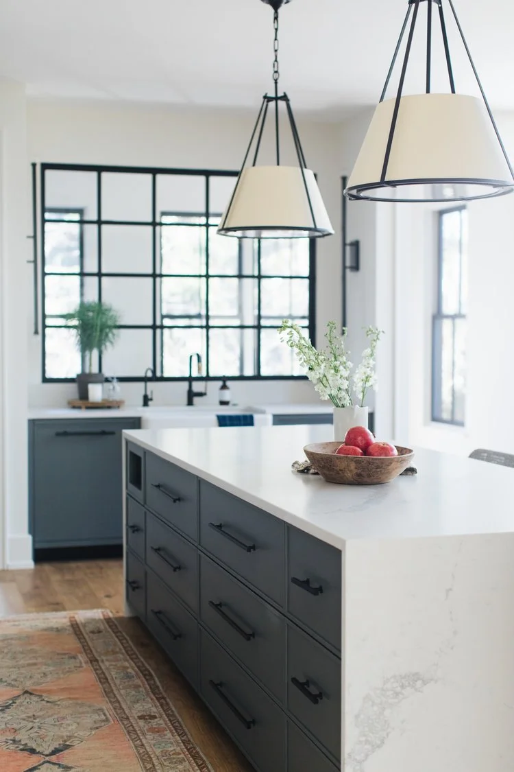 The result is a kitchen that perfectly balances simple, modern lines with classic Craftsman charm. Warm wood tones and deep green accents bring richness and character, creating a space that feels both grounded and inviting.
