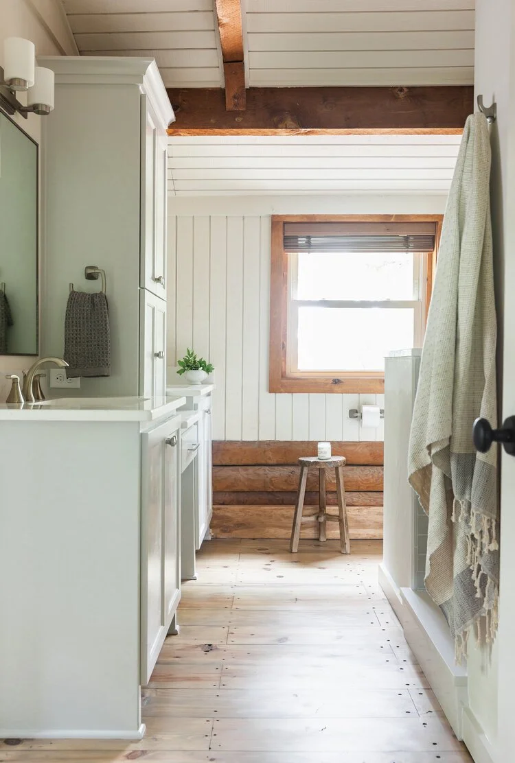This custom attic renovation in East Aurora, NY transformed an underutilized upper level into a warm, functional, and thoughtfully designed bedroom retreat complete with a private en suite bathroom.
