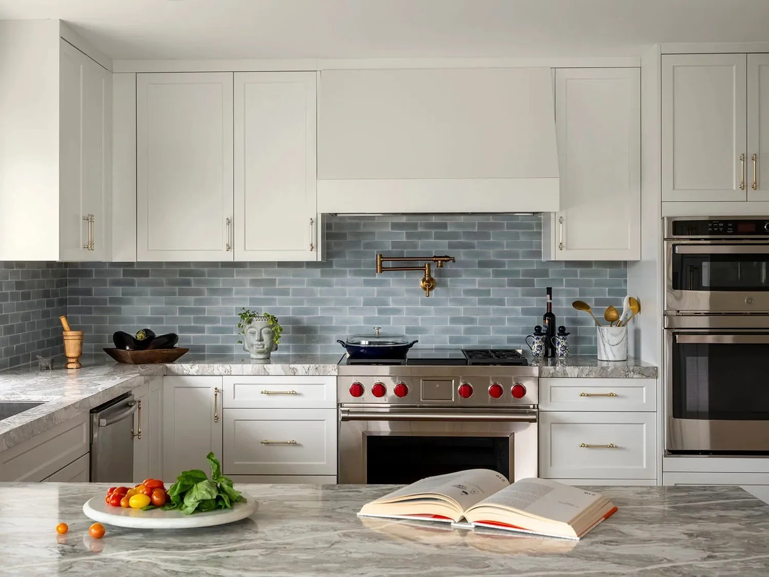  The handmade quality of the tile prevents the room from feeling too polished or flat, giving the kitchen a more relaxed and collected character.