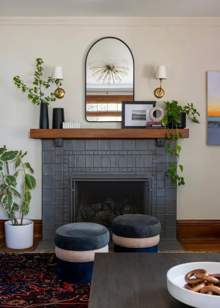A classic Tudor Revival home in Tonawanda thoughtfully updated for a growing family through layered artwork, custom built-ins, rich color, family-friendly furniture, and a considered mix of traditional and modern design.