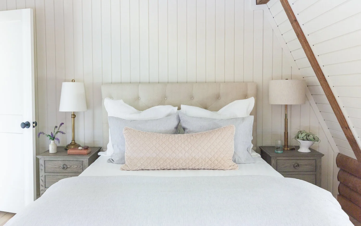 This custom attic renovation in East Aurora, NY transformed an underutilized upper level into a warm, functional, and thoughtfully designed bedroom retreat complete with a private en suite bathroom.