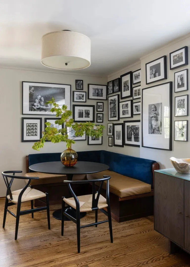 A classic Tudor Revival home in Tonawanda thoughtfully updated for a growing family through layered artwork, custom built-ins, rich color, family-friendly furniture, and a considered mix of traditional and modern design.