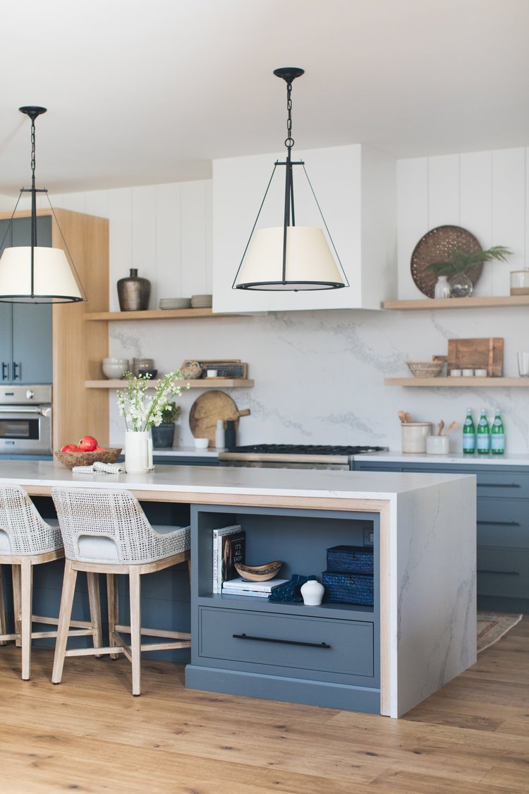 The result is a kitchen that perfectly balances simple, modern lines with classic Craftsman charm. Warm wood tones and deep green accents bring richness and character, creating a space that feels both grounded and inviting.
