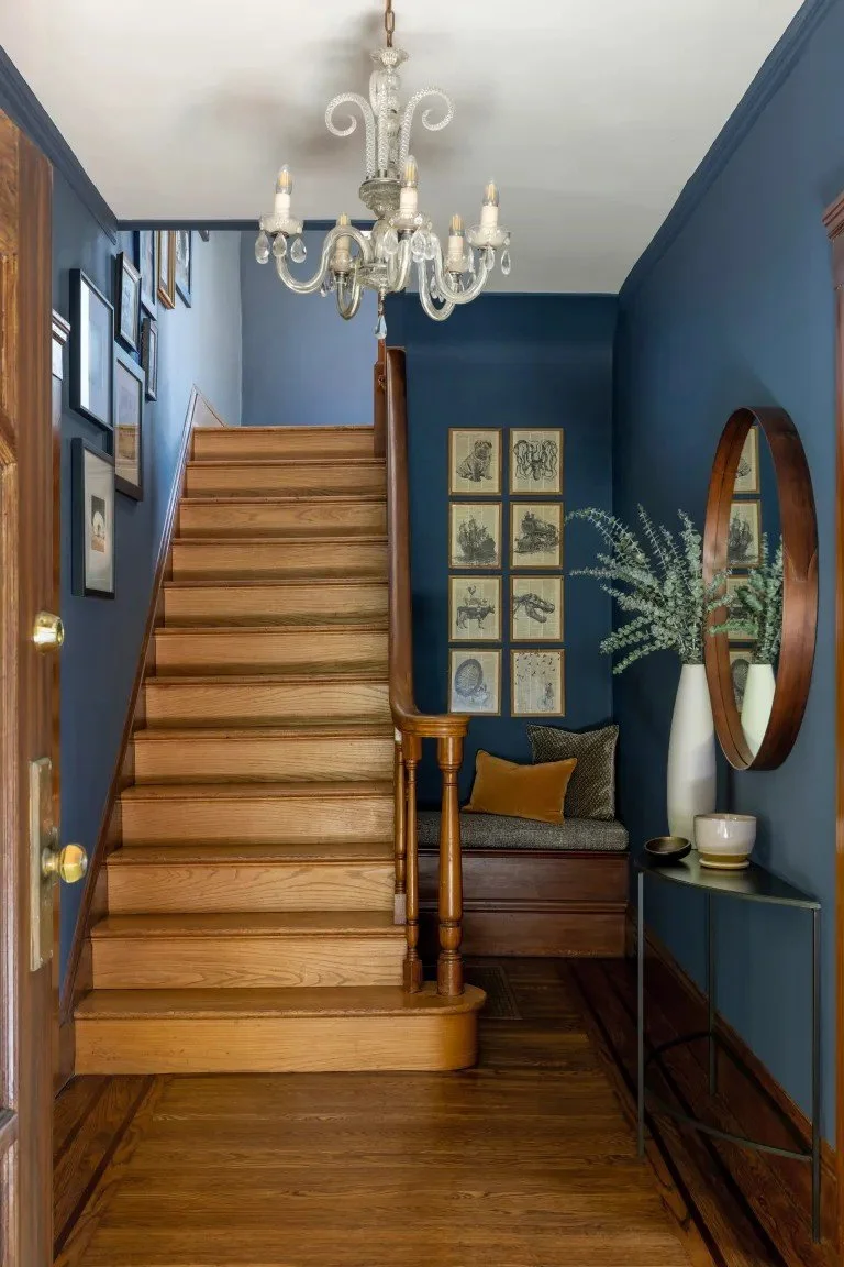 A classic Tudor Revival home in Tonawanda thoughtfully updated for a growing family through layered artwork, custom built-ins, rich color, family-friendly furniture, and a considered mix of traditional and modern design.