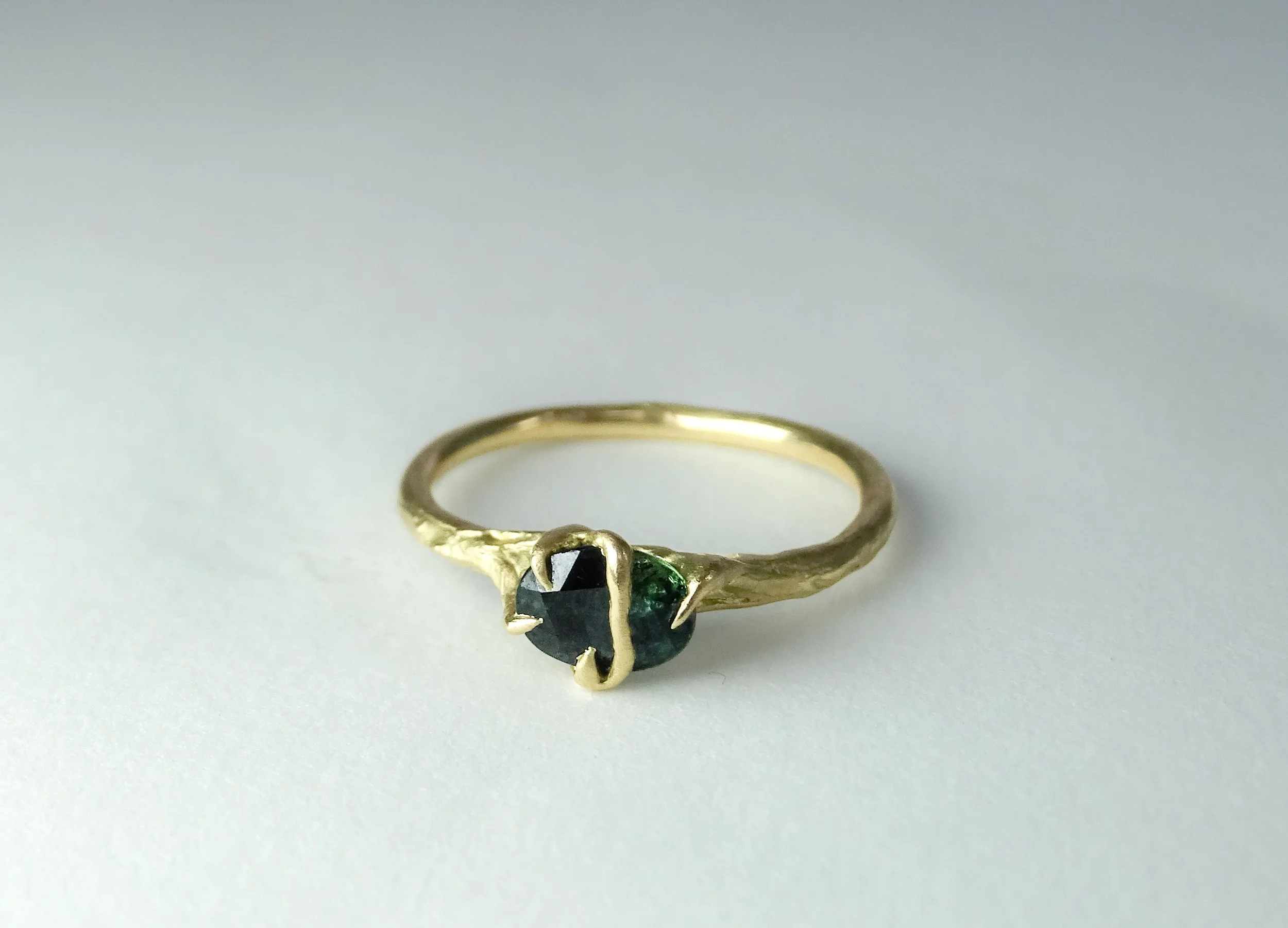 Teal Sapphire Entwined Ring.jpg
