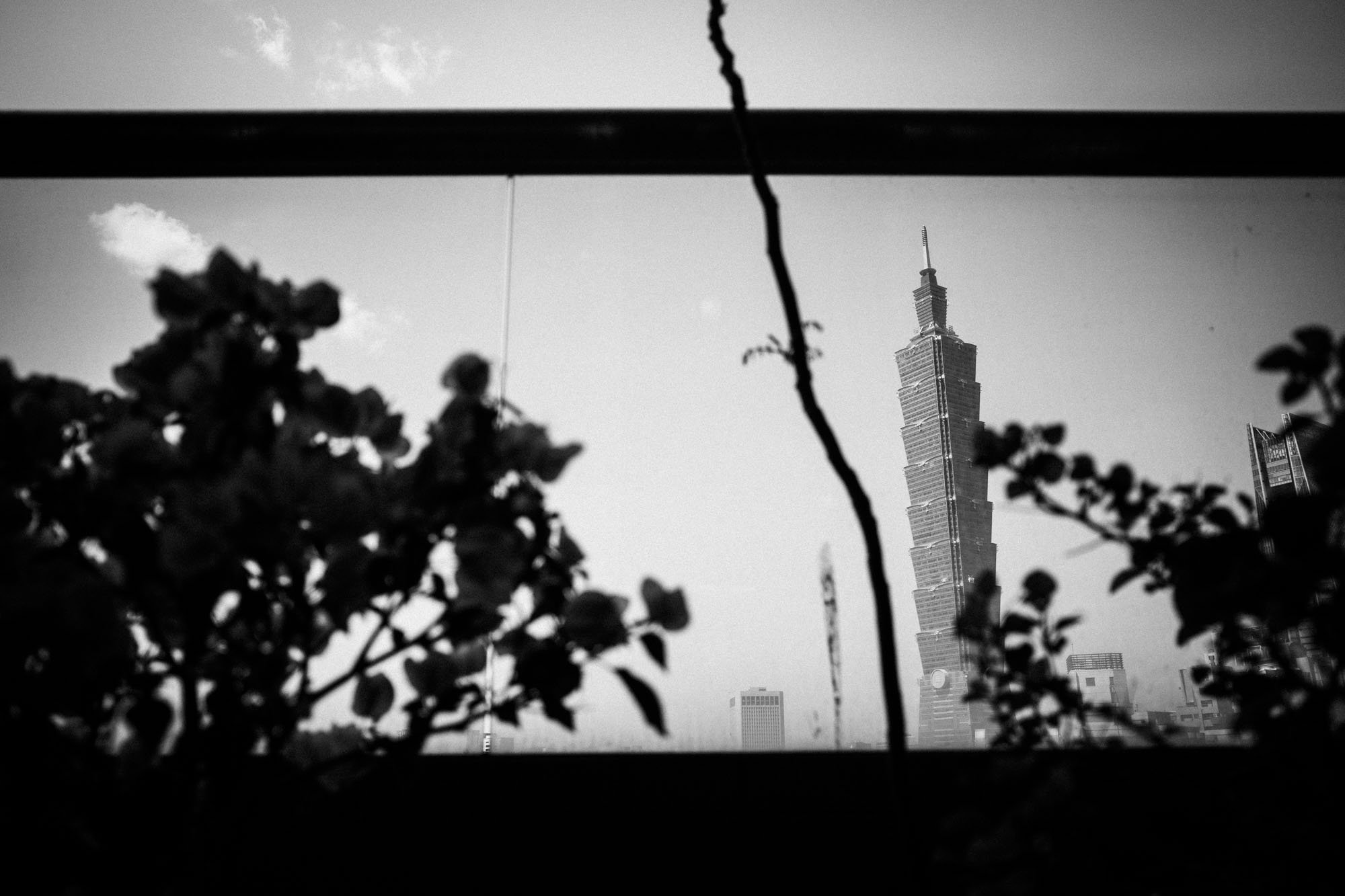 Taipei 101 through a window in an apartment in Taipei.
