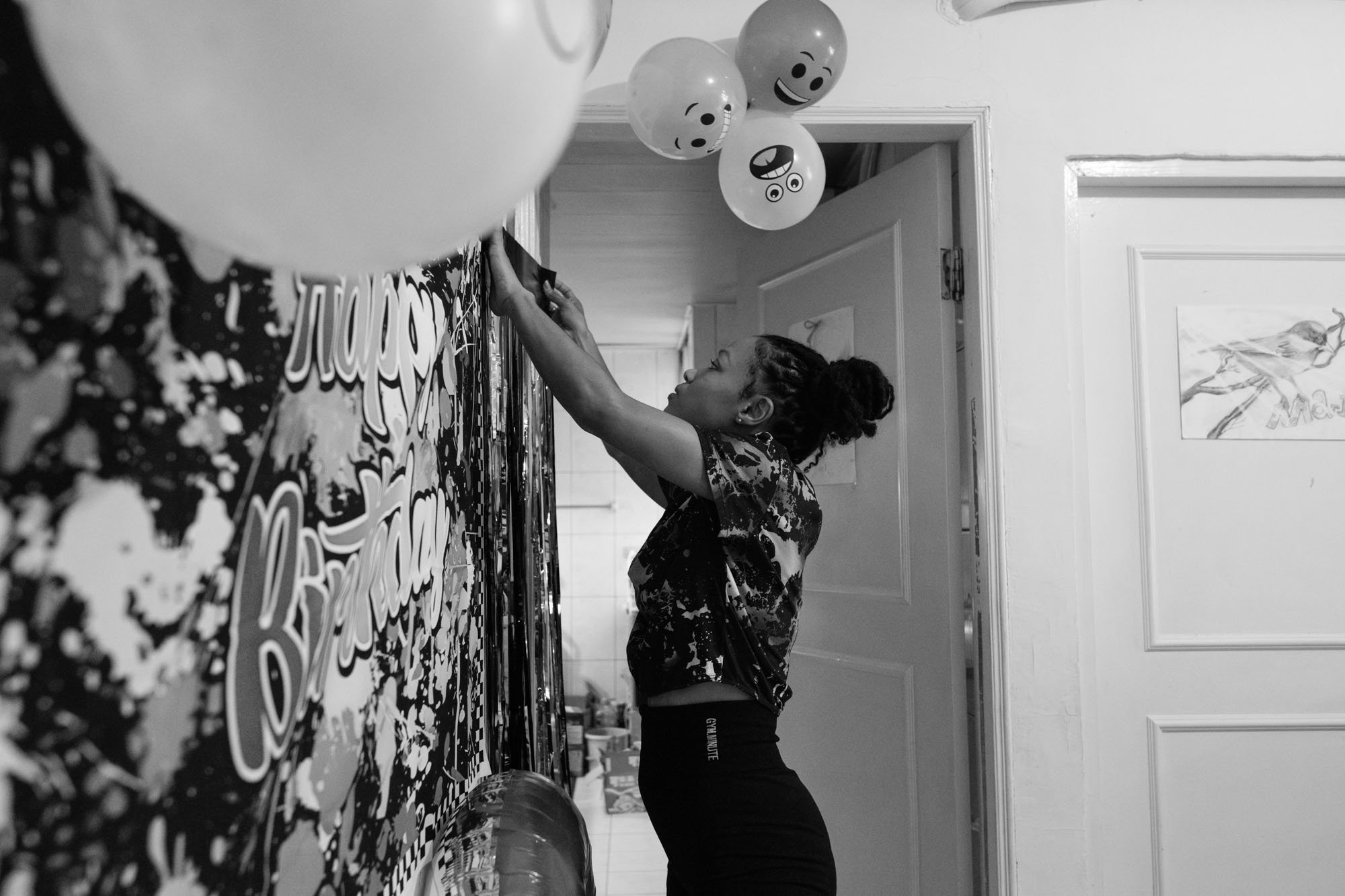 A mother decorates her apartment in Taipei, Taiwan for her daughter's birthday party, which is being photographed by family photographer Cahleen Hudson.