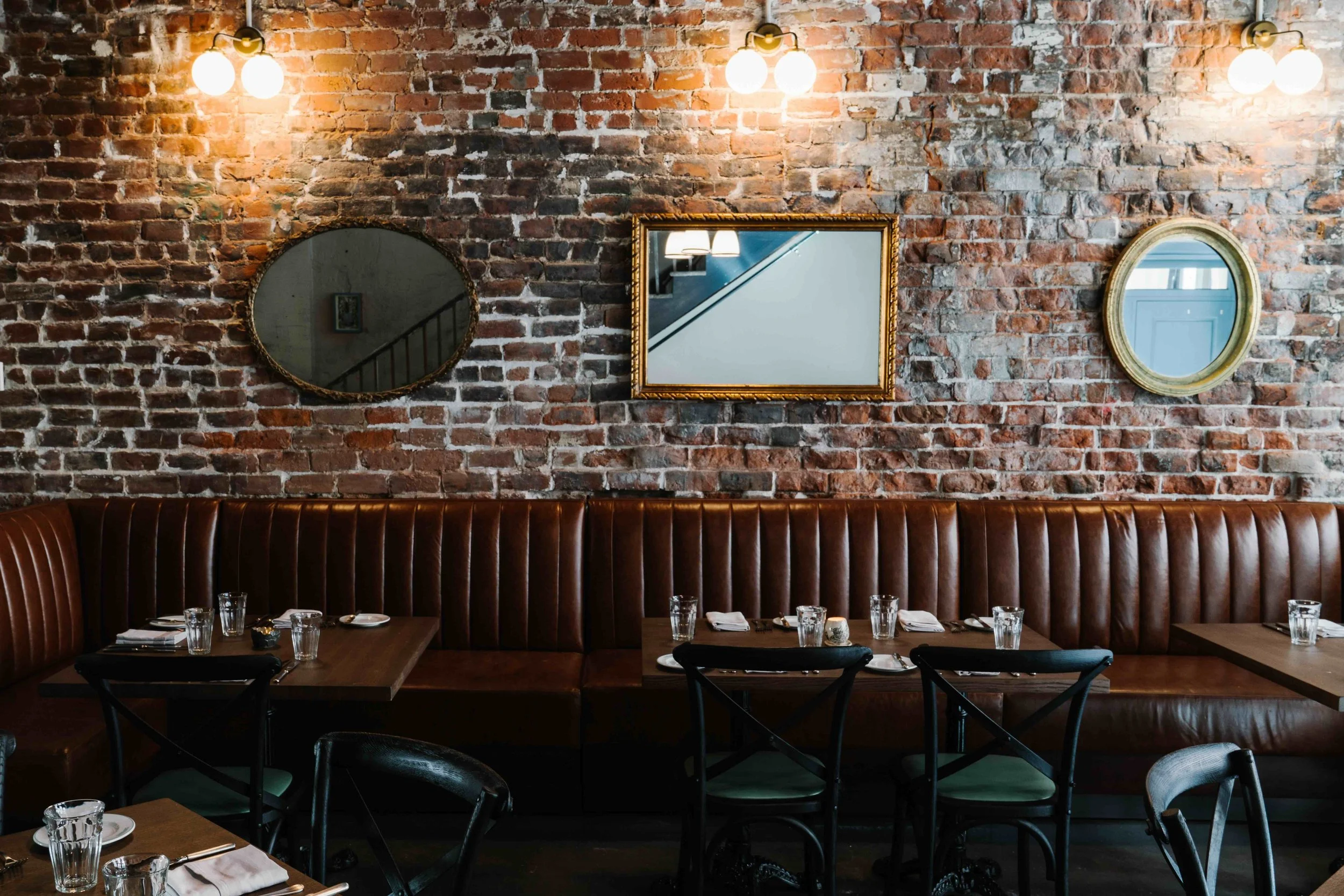 Mirrors above a restaurant booth
