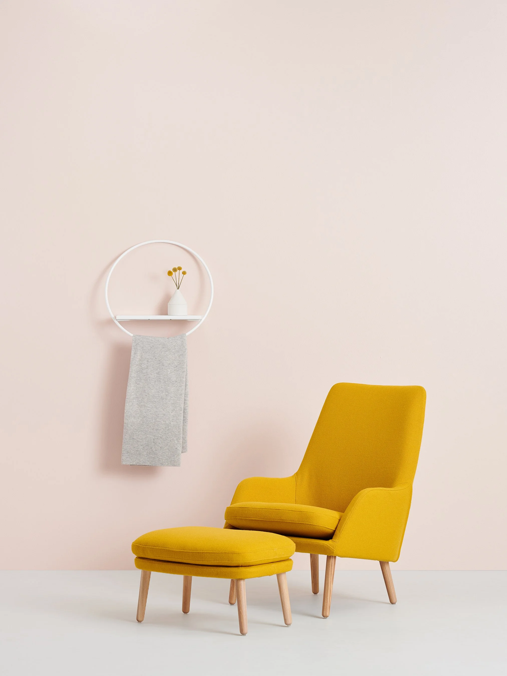 Round white shelf on the wall