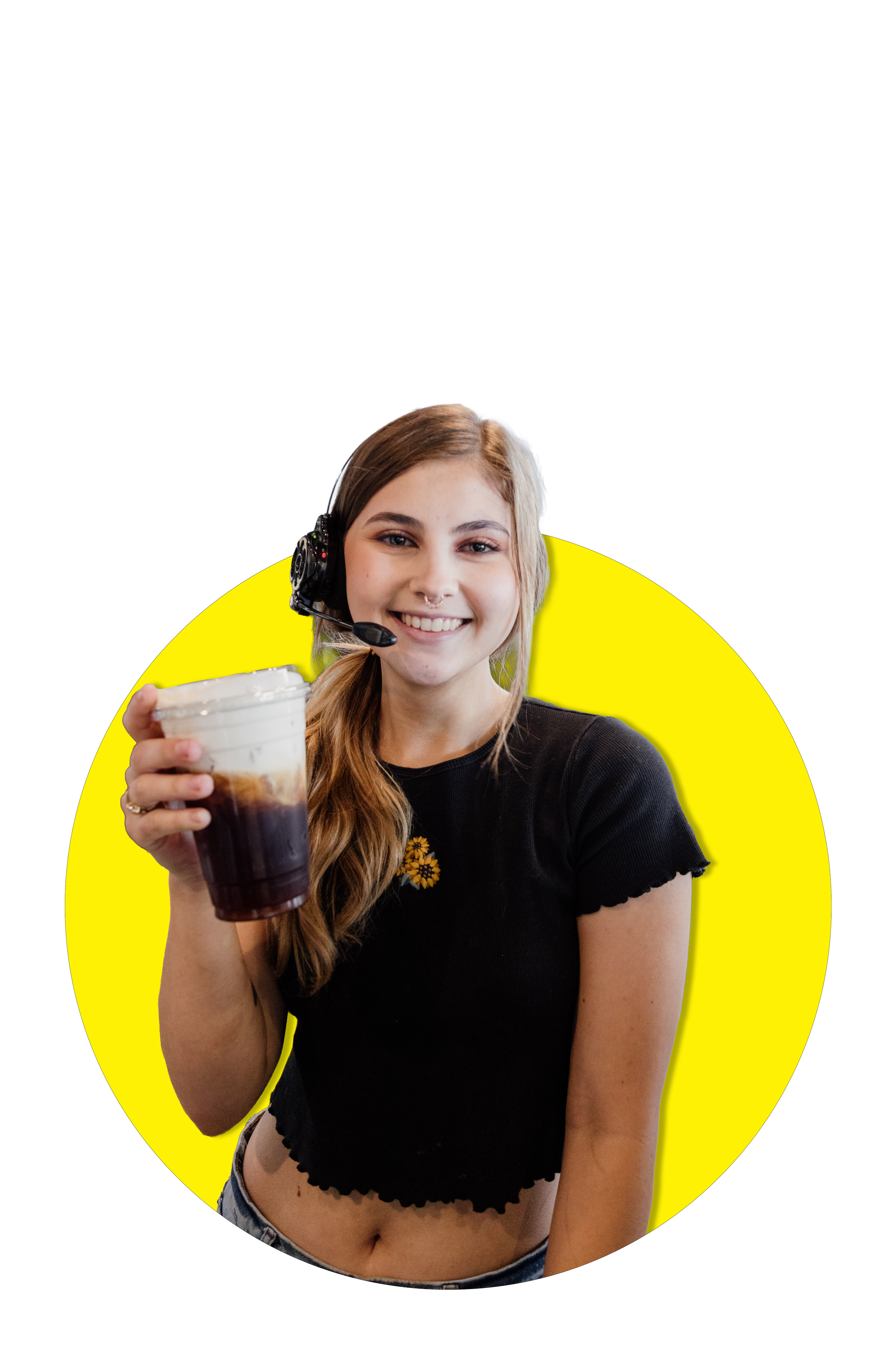 Barista Gianna, holding a cold foam cold brew and smiling