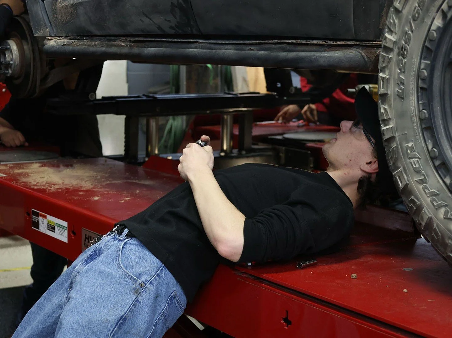 Zachary Clayburn operates underneath a vehicle in the Auto program at High Plains Technology Center. 

📸Photo taken by Multimedia student Tatelyne Reeves.