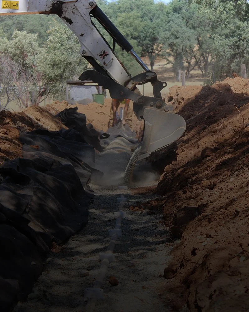 Davis Excavating in Redding, CA digging a septic system for a home