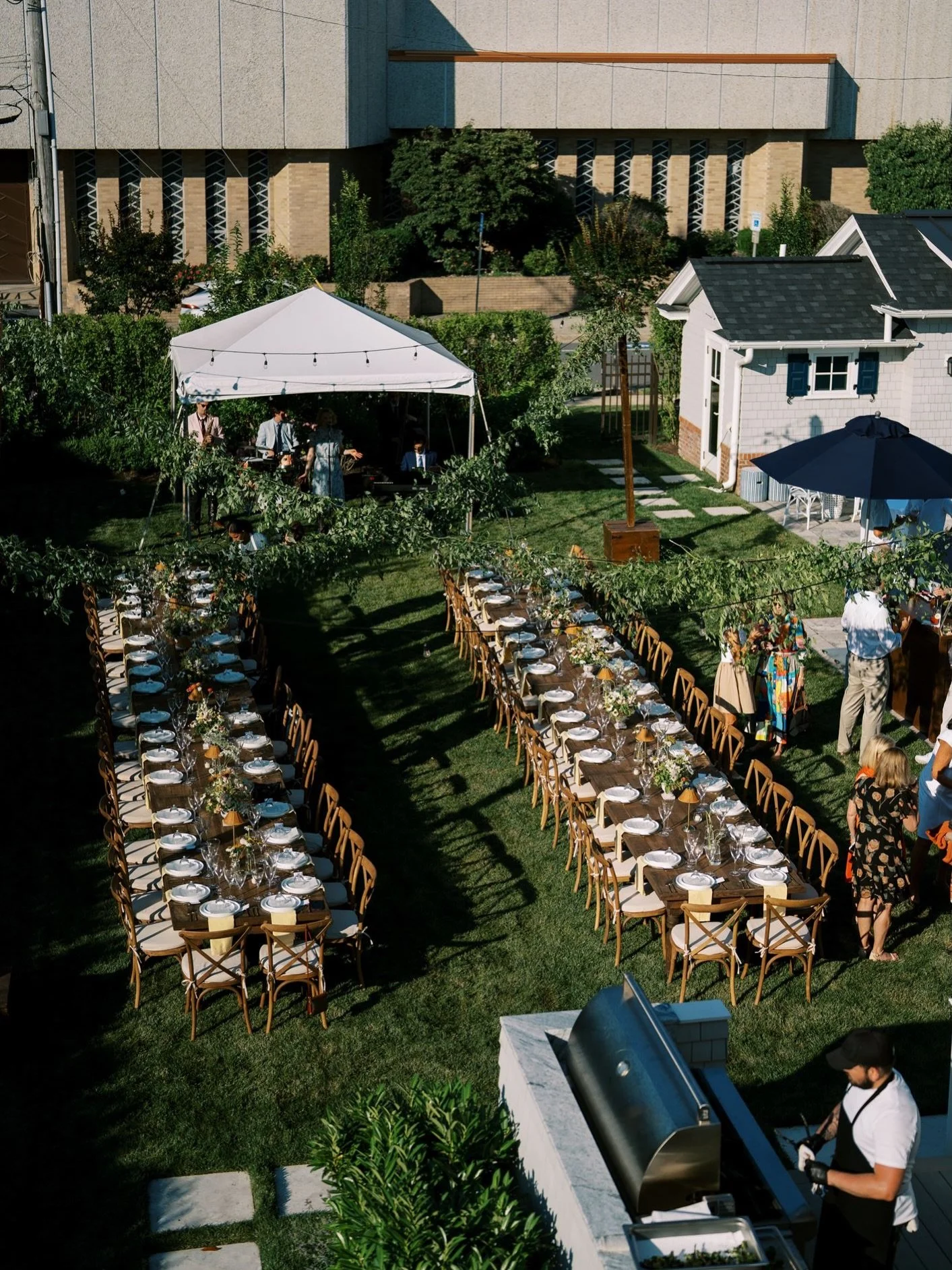 Two long tables beat twelve small ones.

We&rsquo;ve hosted enough dinners to know that seating sets the tone. Spread guests across small tables and conversation stays in small circles. Seat them along a long table and the room opens up. Everyone can